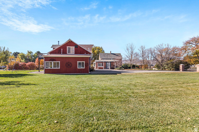 390 North 100 West Monroe, UT 84754 - Photo 31 of 167 Rear view of house featuring a lawn