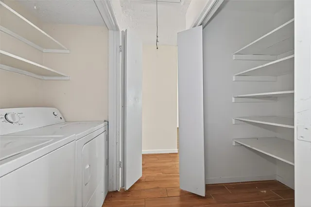 a view of storage and utility room with washer and dryer