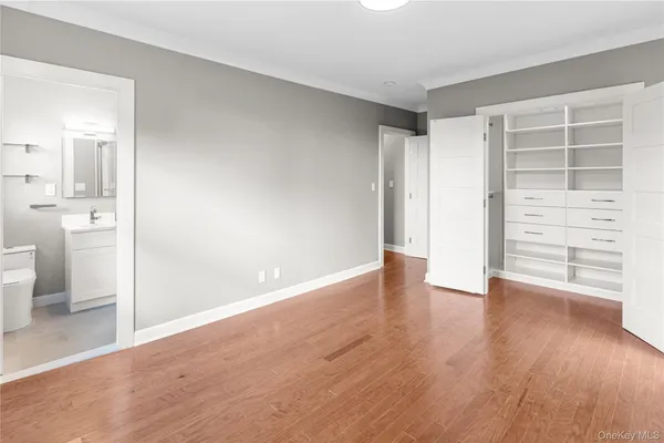 wooden floor in an empty room and a window