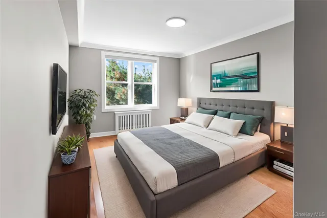 a bedroom with bed and a window