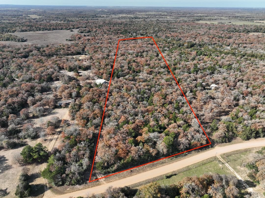 881 Cr 327 Road Rockdale, TX 76567 - Photo 8 of 8 an aerial view of house with yard and mountain in the background