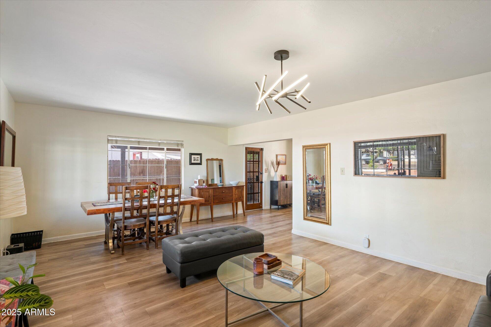 1405 East Osborn Road Phoenix, AZ 85014 - Photo 13 of 30 a living room with furniture and wooden floor