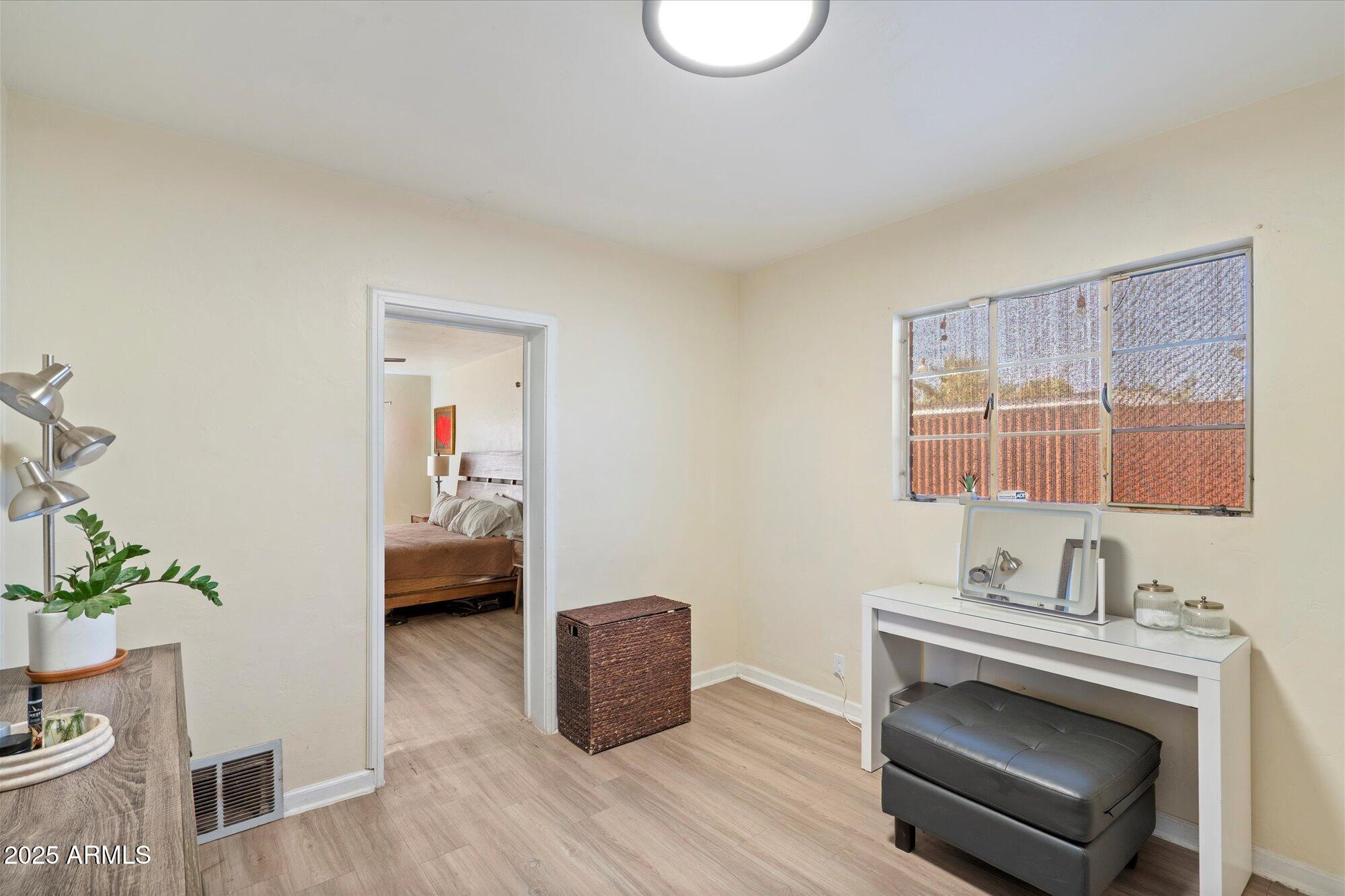 1405 East Osborn Road Phoenix, AZ 85014 - Photo 14 of 30 a living room with furniture and a wooden floor
