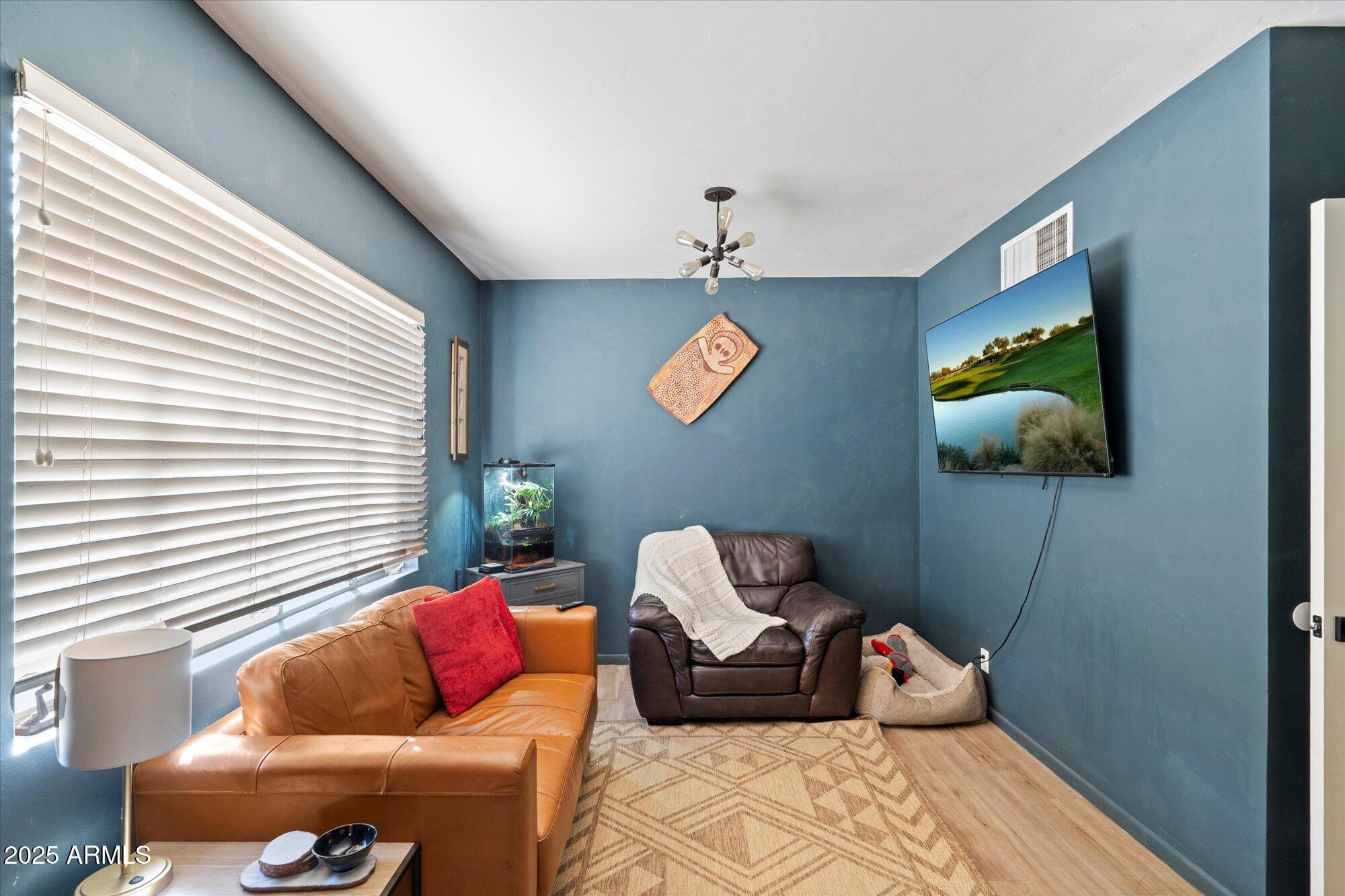 1405 East Osborn Road Phoenix, AZ 85014 - Photo 21 of 30 a living room with furniture and a flat screen tv