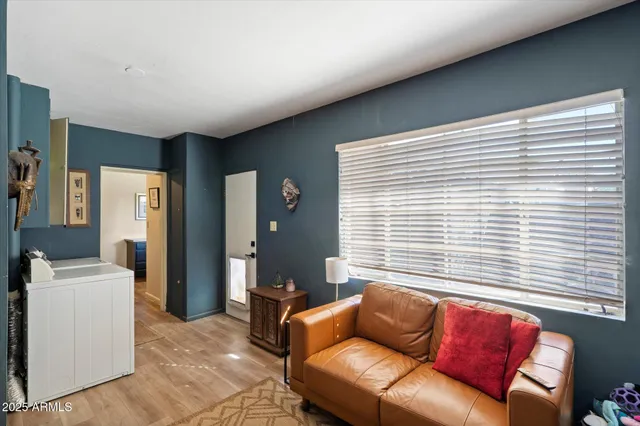 a living room with furniture and a window
