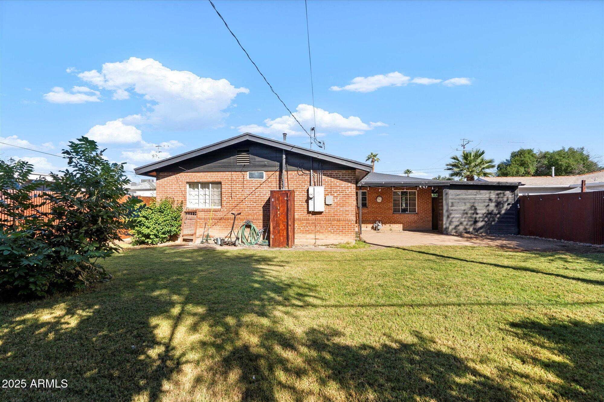 1405 East Osborn Road Phoenix, AZ 85014 - Photo 25 of 30 a front view of a house with a yard