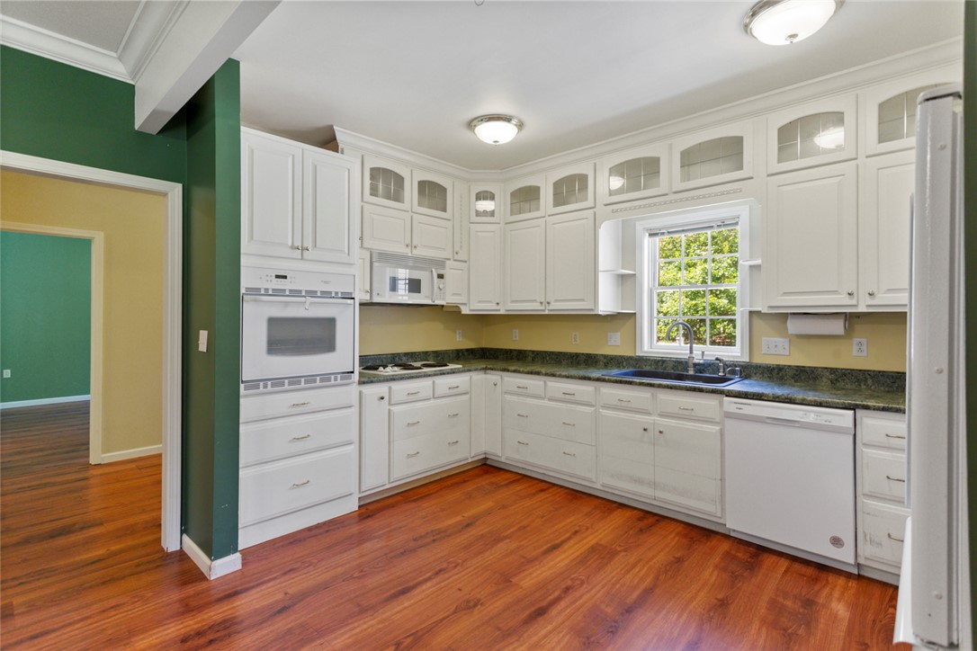 621 Burns Mill Road West Union, SC 29696 - Photo 39 of 45 A well-equipped kitchen features ample cabinetry, generous counter space, and durable hardwood flooring.