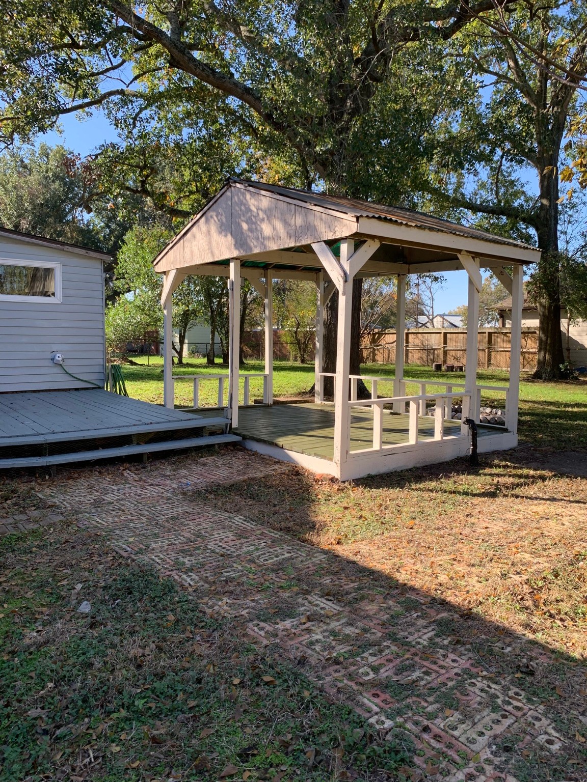 1315 Penick Road Waller, TX 77484 - Photo 13 of 13 a view of a patio with a table and chairs under an umbrella