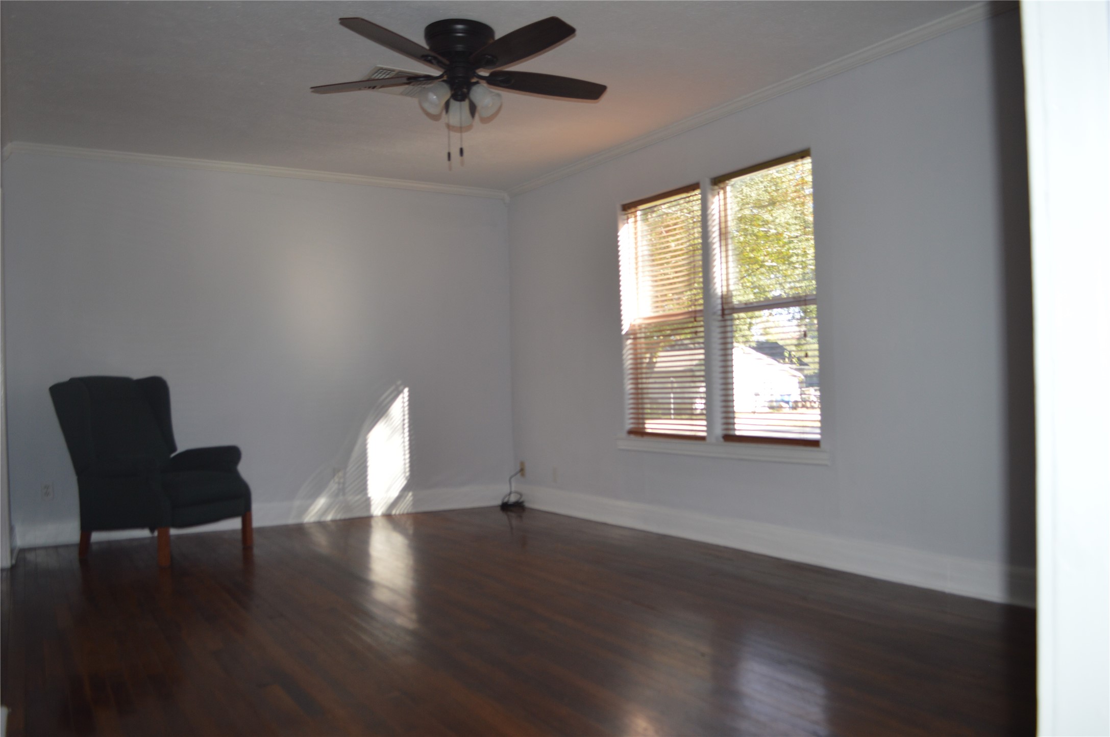 1315 Penick Road Waller, TX 77484 - Photo 3 of 13 a view of a livingroom with furniture wooden floor and a window