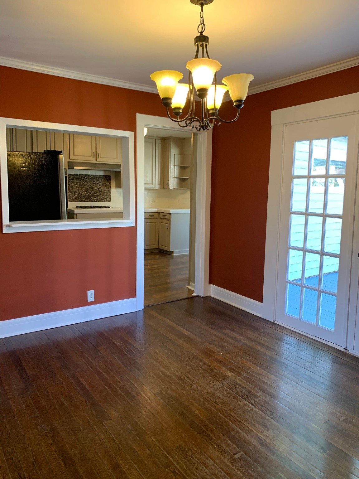 1315 Penick Road Waller, TX 77484 - Photo 4 of 13 a view of a livingroom with wooden floor and chandelier