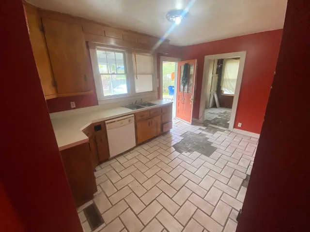 a large bathroom with a sink a mirror and a bathtub