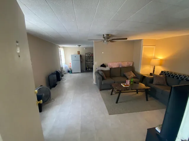 a view of a hallway and wooden floor