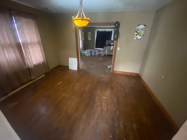 a view of empty room with a fireplace