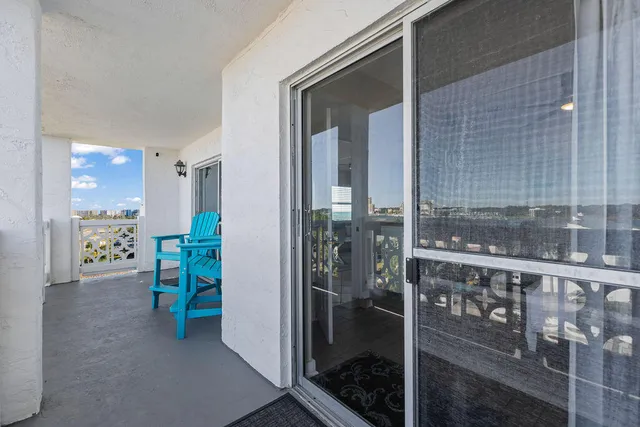 a view of a balcony with furniture