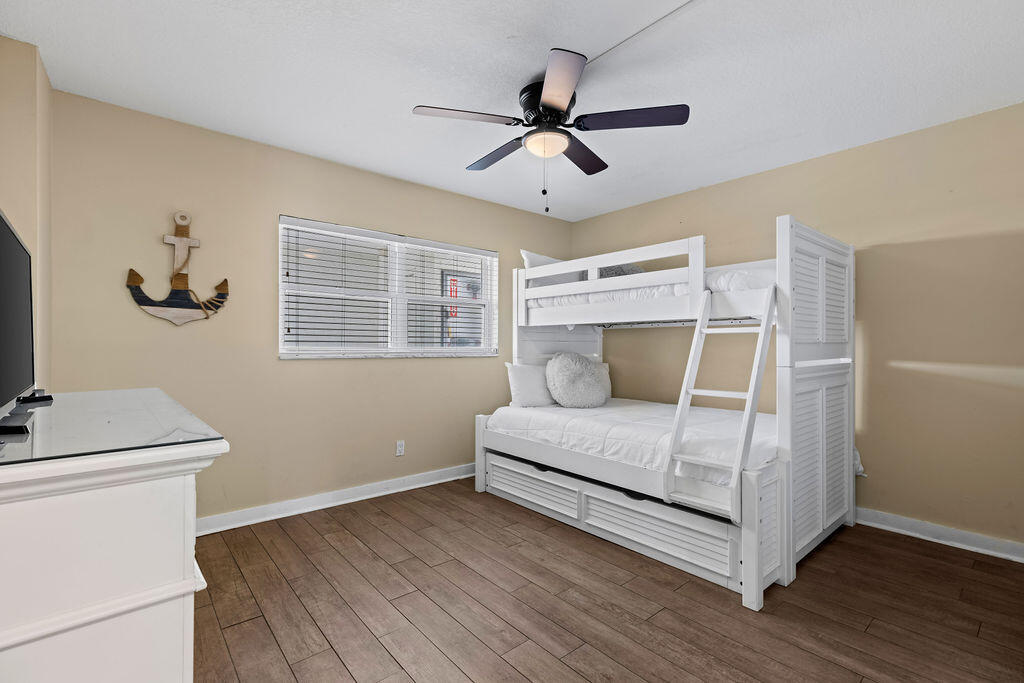 909 Santa Rosa Boulevard, Unit 569 Fort Walton Beach, FL 32548 - Photo 26 of 57 a bedroom with a bed and a window
