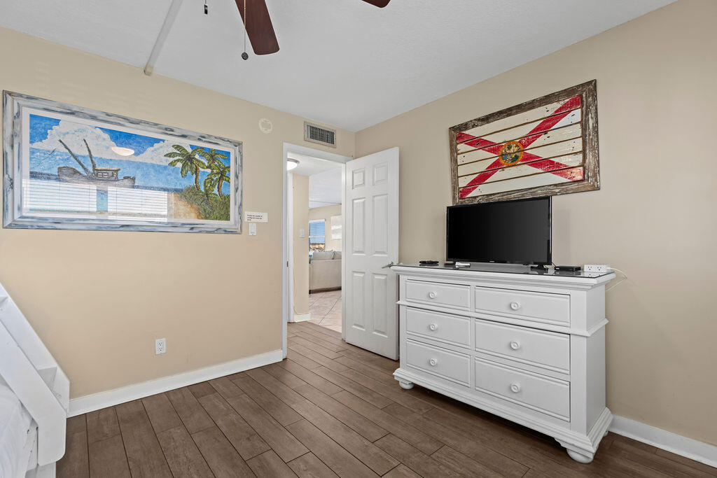 909 Santa Rosa Boulevard, Unit 569 Fort Walton Beach, FL 32548 - Photo 28 of 57 a room with furniture and flat screen tv
