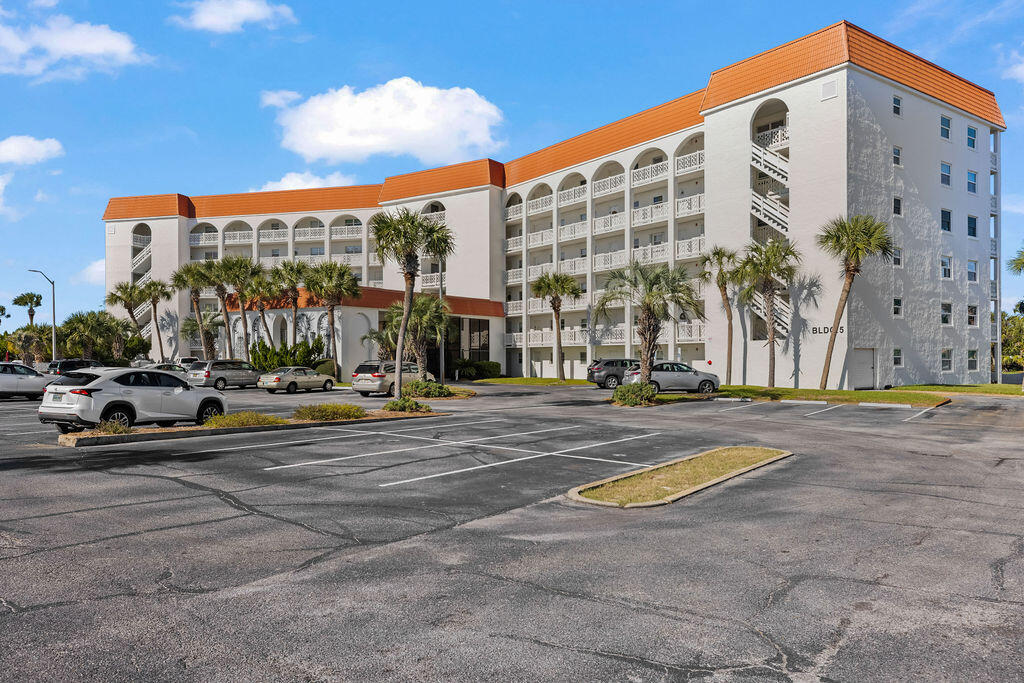 909 Santa Rosa Boulevard, Unit 569 Fort Walton Beach, FL 32548 - Photo 54 of 57 a view of a tall building next to a road