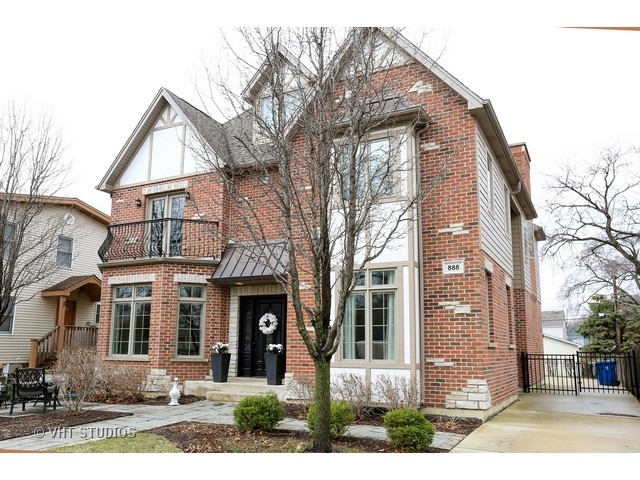 888 Spring Road Elmhurst, IL 60126 - Photo 1 of 22 front view of house with a street