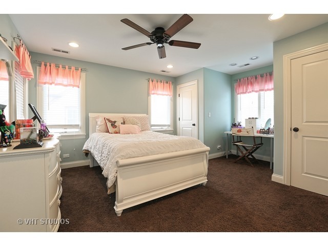 888 Spring Road Elmhurst, IL 60126 - Photo 15 of 22 a bedroom with a bed and window