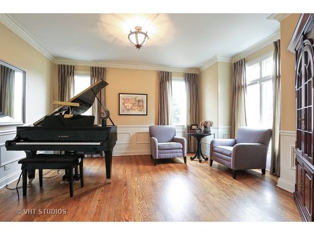 888 Spring Road Elmhurst, IL 60126 - Photo 2 of 22 a living room with furniture and a wooden floor