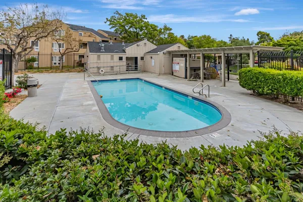 front view of a house with a swimming pool