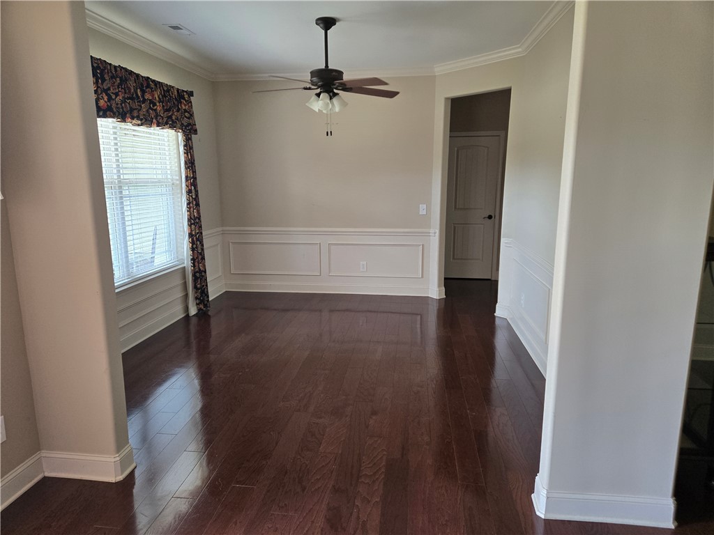 304 Knoll View Drive Seneca, SC 29678 - Photo 6 of 36 This inviting space features rich hardwood floors and elegant crown molding, ready for your personal touch.