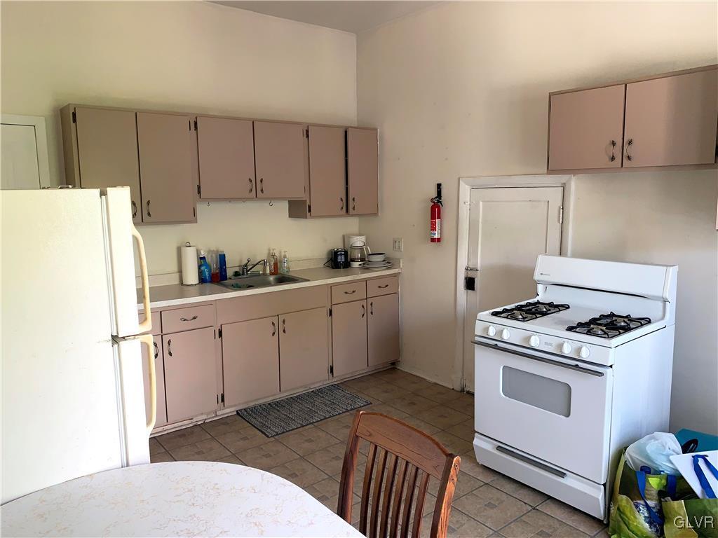 30 North Main Street Bangor, PA 18013 - Photo 5 of 13 a kitchen with cabinets appliances and a sink