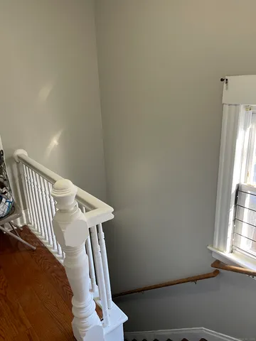 a view of a hallway with windows