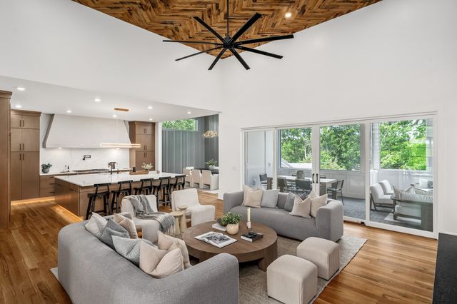 a bathroom with a tub sink and mirror