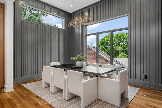 a bathroom with a toilet a sink a mirror a bathtub and shower