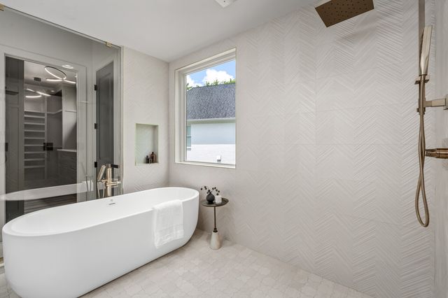 a view of a hallway with wooden floor and closet