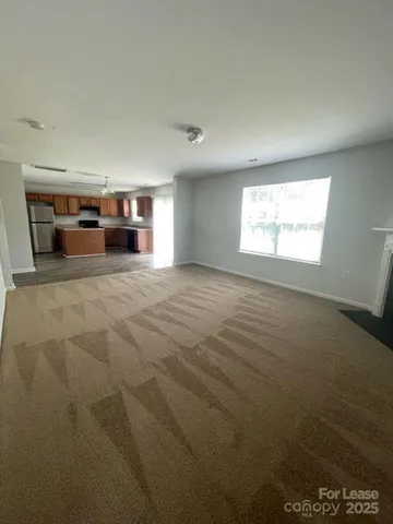 a view of a livingroom with furniture and window