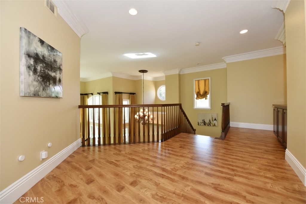 12 Brigadier Irvine, CA 92603 - Photo 42 of 50 a view of a hallway with wooden floor