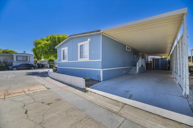 a view of house with outdoor space and seating area