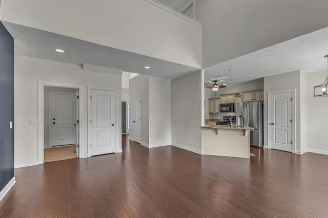 a view of a kitchen with a sink stainless steel appliances and cabinets