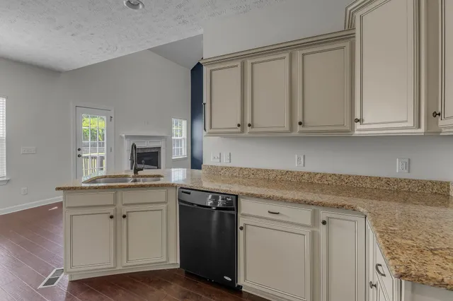 a kitchen with stainless steel appliances white cabinets and a stove