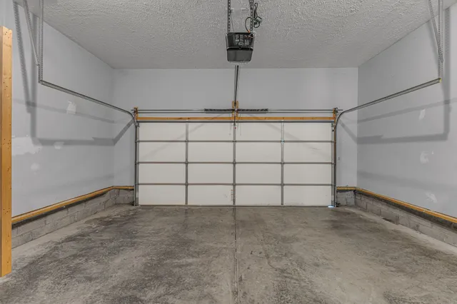 a view of room with stairs and a ceiling fan