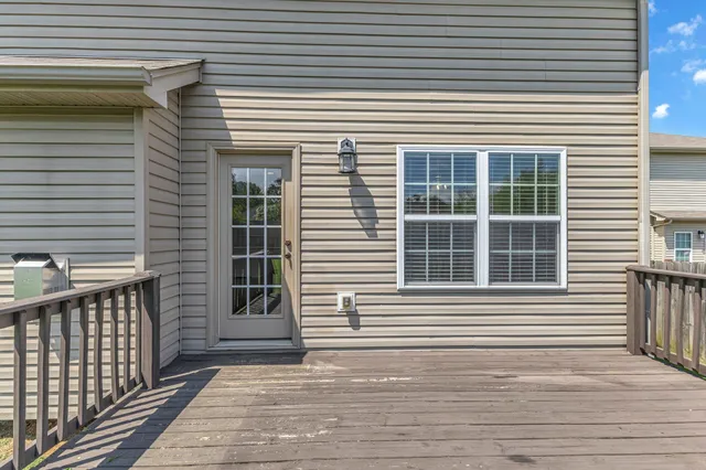 a view of deck with wooden floor and fence