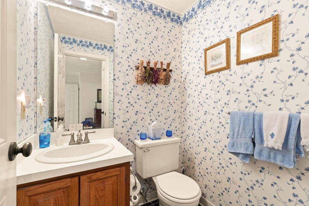 7 Apple Ridge Road, Unit 2 Maynard, MA 01754 - Photo 11 of 27 a bathroom with a sink a toilet and shower curtain
