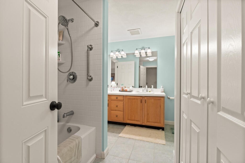 7 Apple Ridge Road, Unit 2 Maynard, MA 01754 - Photo 15 of 27 a bathroom with a tub sink and mirror