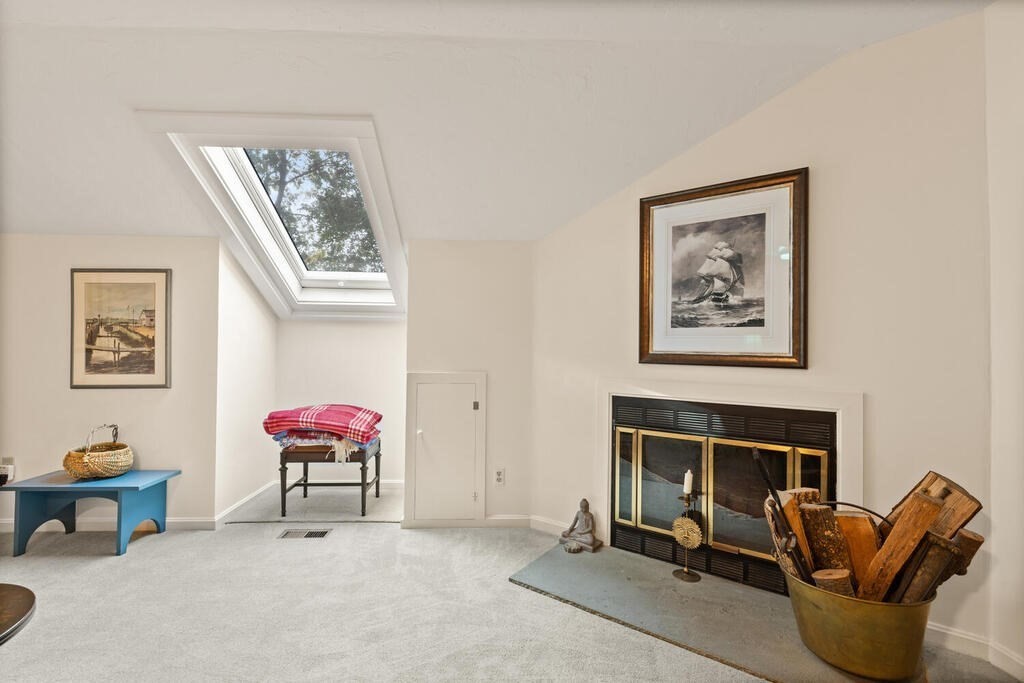 7 Apple Ridge Road, Unit 2 Maynard, MA 01754 - Photo 22 of 27 a living room with furniture a window and a fireplace