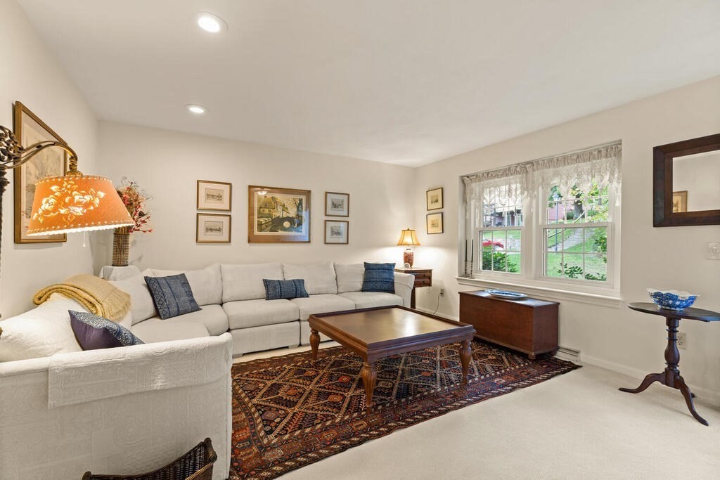 7 Apple Ridge Road, Unit 2 Maynard, MA 01754 - Photo 3 of 27 a living room with furniture and a window