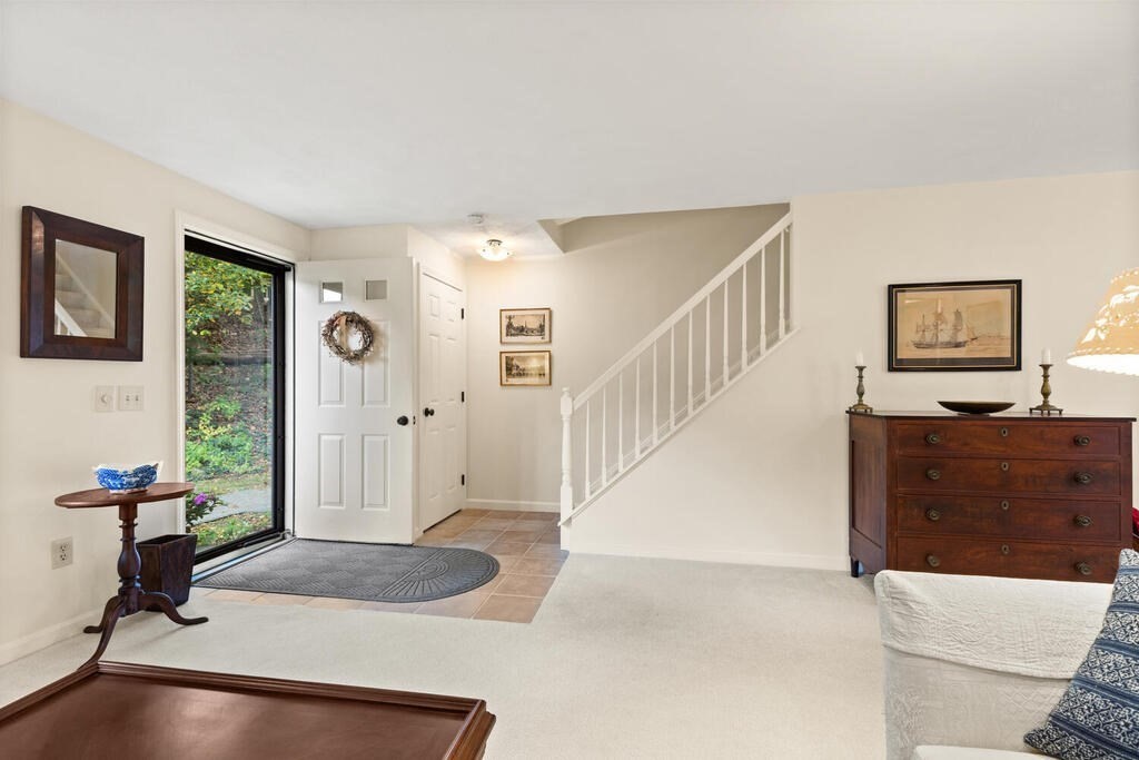 7 Apple Ridge Road, Unit 2 Maynard, MA 01754 - Photo 6 of 27 a living room with furniture and a fireplace