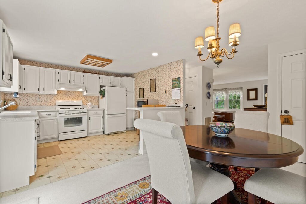 7 Apple Ridge Road, Unit 2 Maynard, MA 01754 - Photo 8 of 27 a view of a dining room with furniture and wooden floor