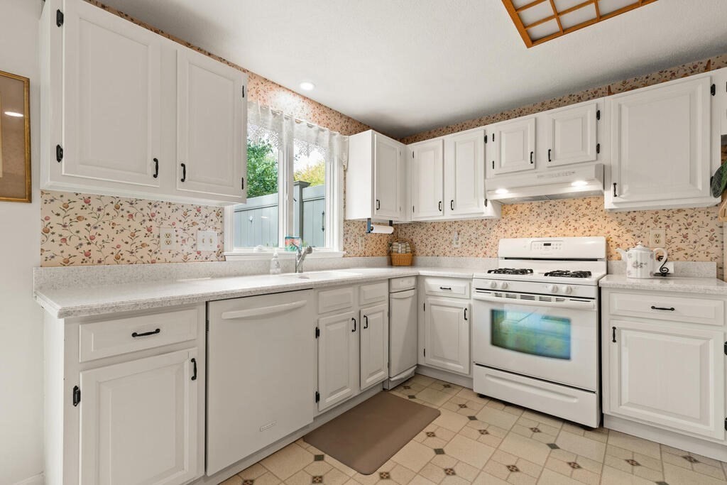 7 Apple Ridge Road, Unit 2 Maynard, MA 01754 - Photo 9 of 27 a kitchen with granite countertop white cabinets and white appliances