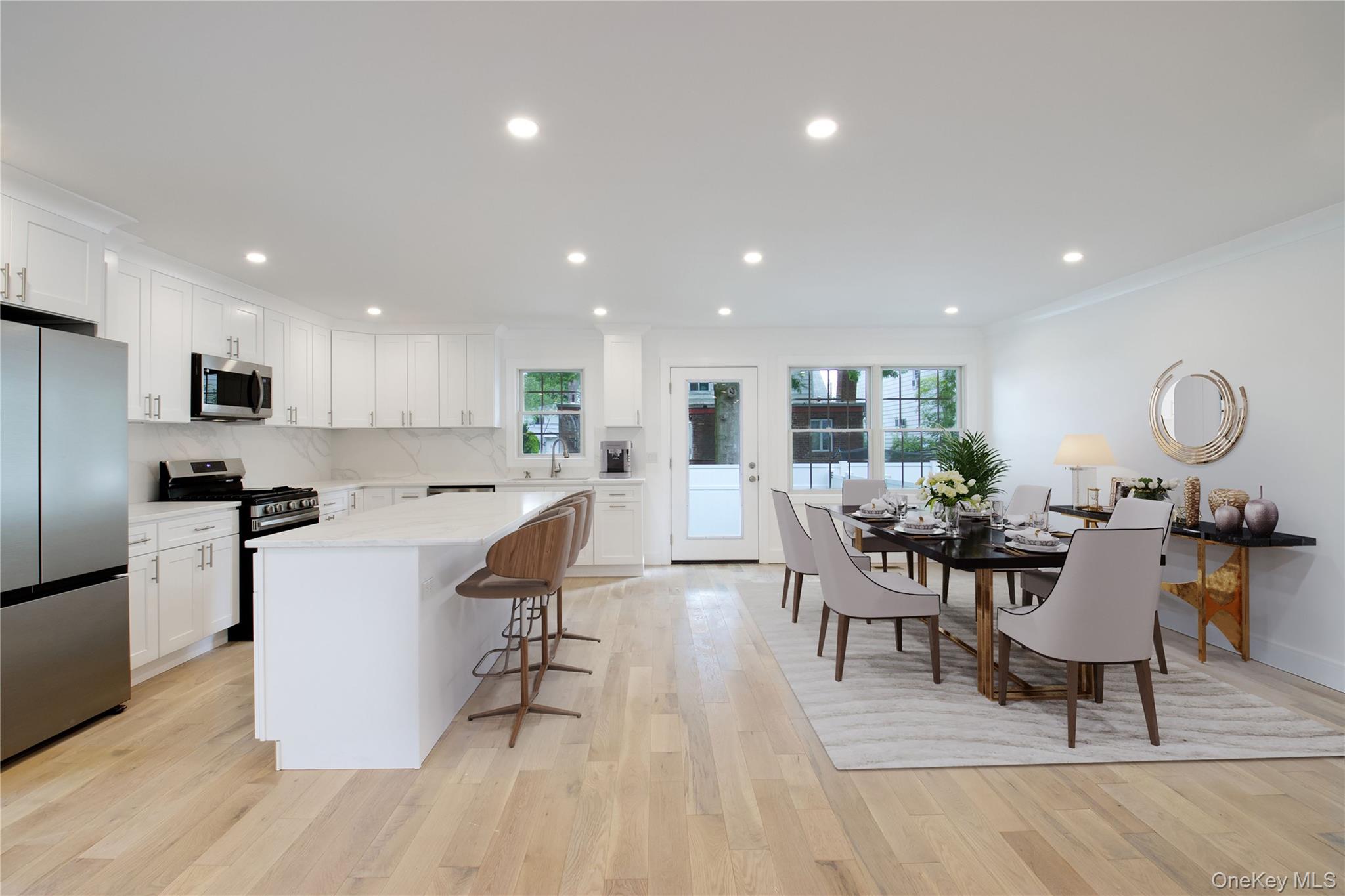30 Kirkwood Road, Unit B Port Washington, NY 11050 - Photo 6 of 36 a living room with stainless steel appliances granite countertop furniture wooden floor and a view of kitchen