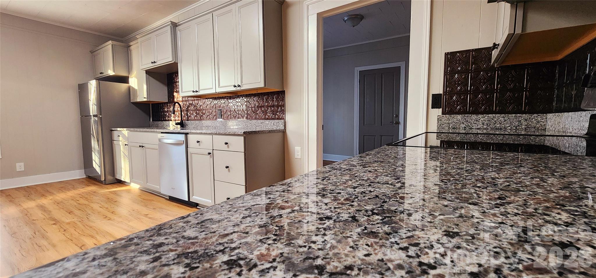 359 Flat Rock Road Lawndale, NC 28090 - Photo 11 of 19 a kitchen with stainless steel appliances granite countertop a refrigerator a stove and a sink