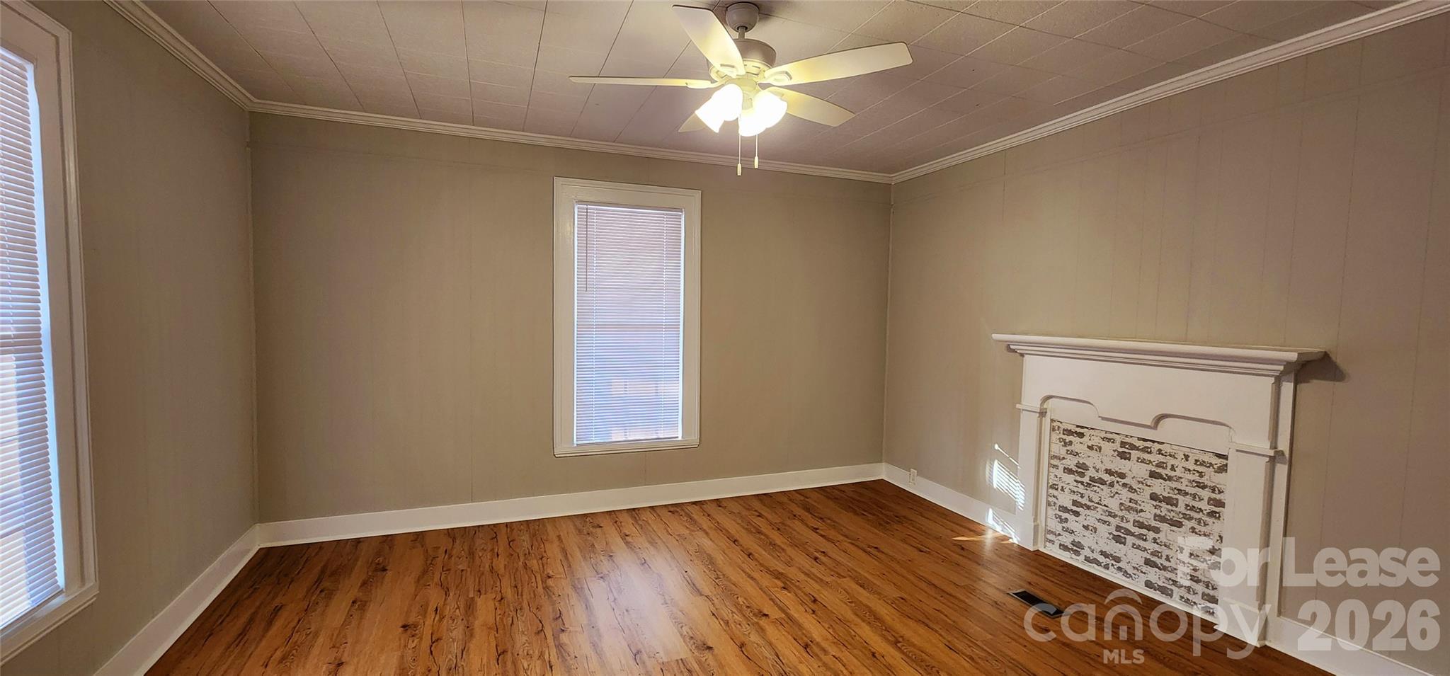 359 Flat Rock Road Lawndale, NC 28090 - Photo 12 of 19 a view of an empty room with window and wooden floor