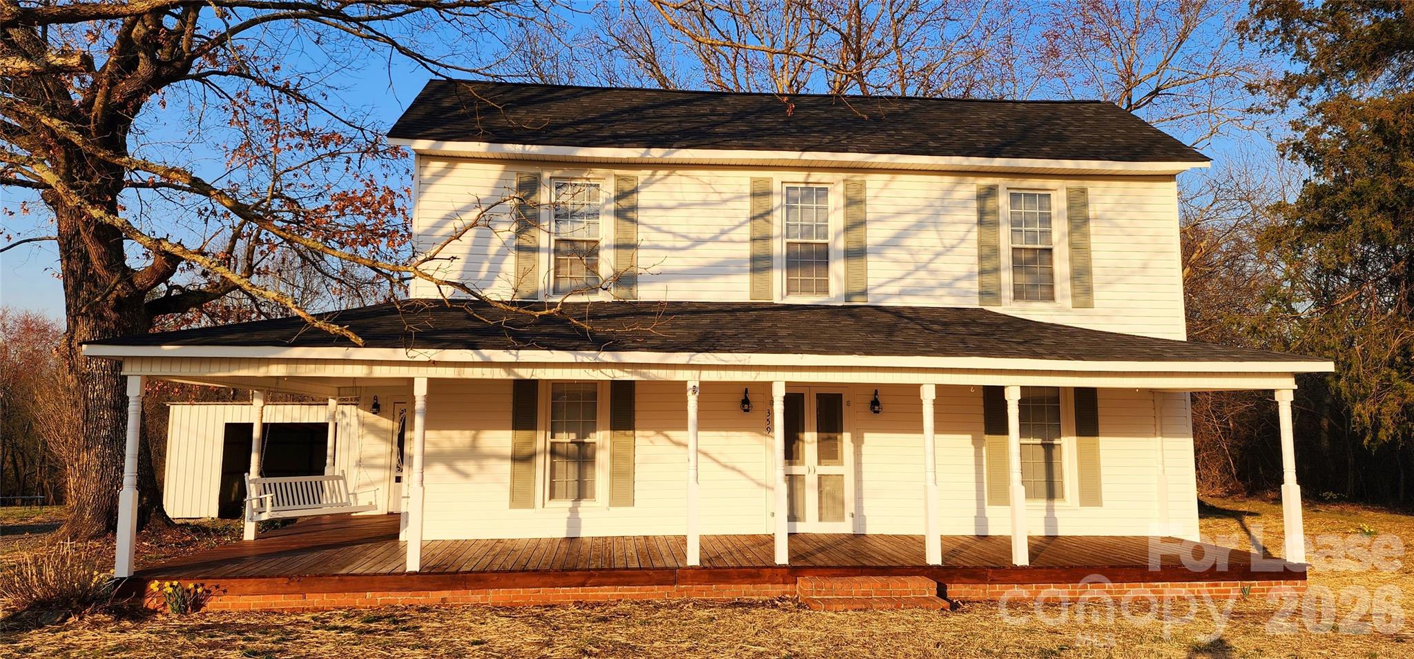 359 Flat Rock Road Lawndale, NC 28090 - Photo 2 of 19 a front view of a house with a yard