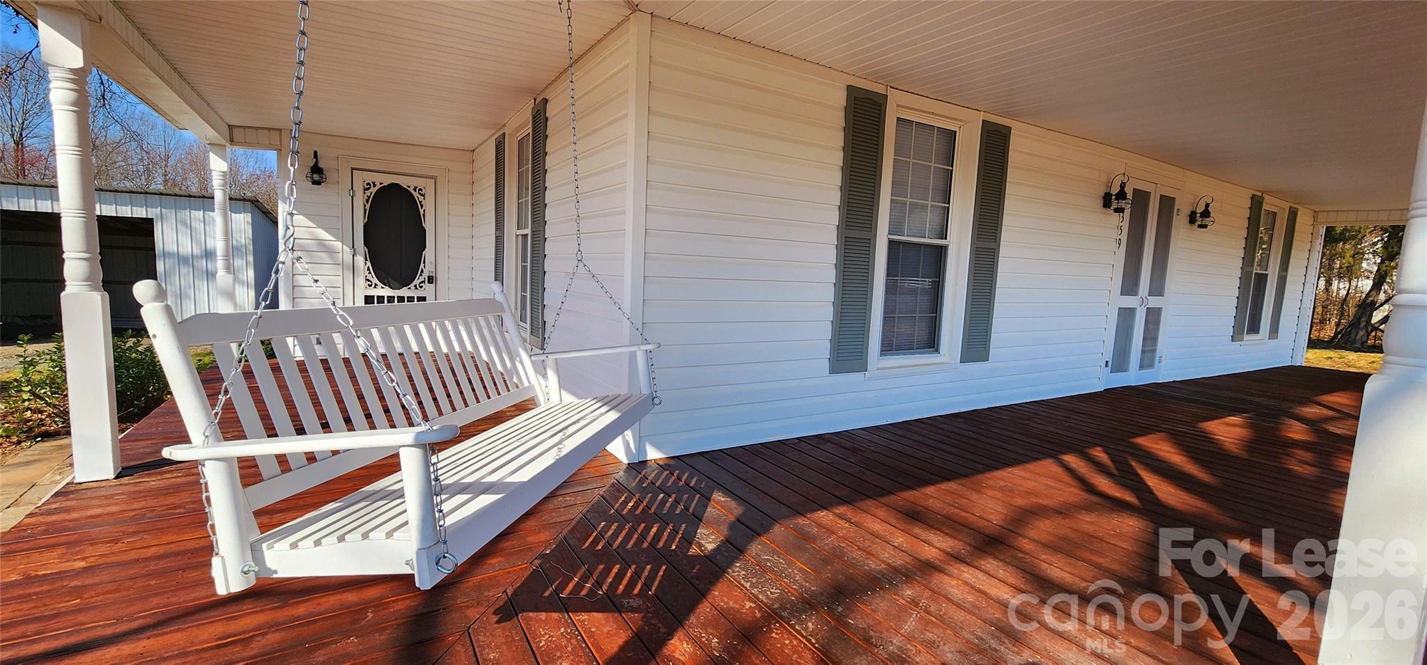 359 Flat Rock Road Lawndale, NC 28090 - Photo 4 of 19 a view of balcony with wooden floor